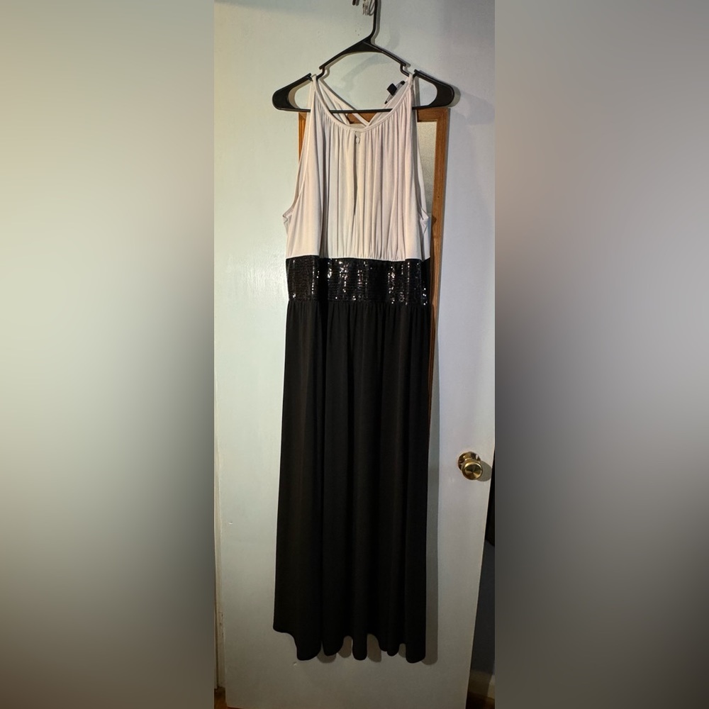 Black and white formal dress. Slit on chest but doesn’t show too much cleavage!